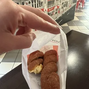 Donuts to go. Didn't make it out of the restaurant without taking a bite.