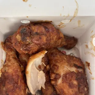 a close up of a box of fried chicken