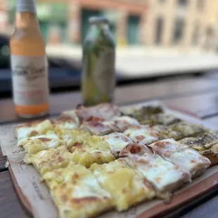 a pizza and a beer on a table