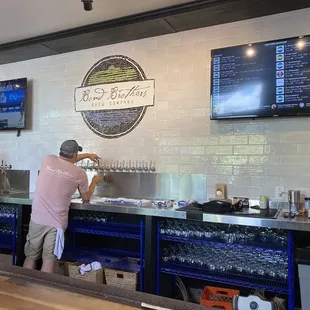 two men working behind the bar