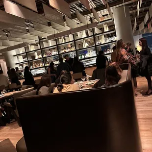 a group of people sitting in a restaurant