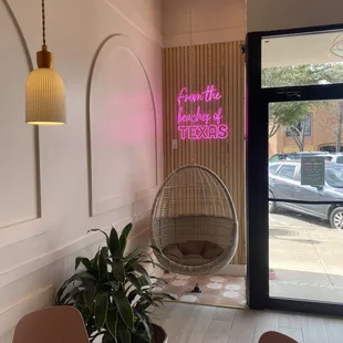 a hanging chair in the middle of a room