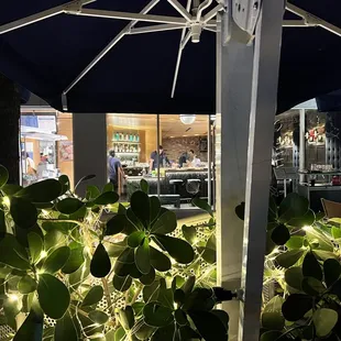 a restaurant with a blue umbrella