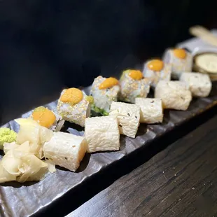 a long rectangular platter of sushi