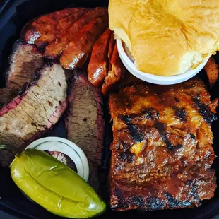 Spicy sausage links, sliced brisket, baby back ribs