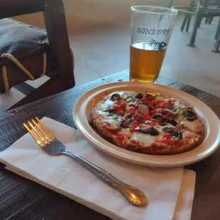 A very small $11 veggie pizza with a Left Coast Brewery Duck Dive hefeweizen
