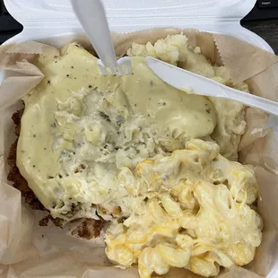 Smothered Fried Chicken, mashed potatoes and gravy, Mac and cheese!