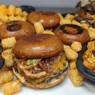 a variety of burgers and tater tots