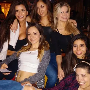 a group of women posing for a picture