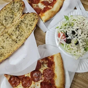 Pepperoni combos (one with garlic bread, one with salad; 2 drinks not pictured)