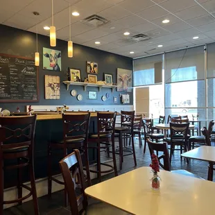 mpty tables and chairs in a restaurant