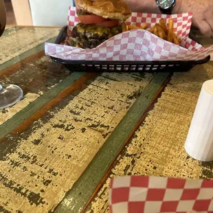 Burger with seasoned fries. Not sure name of burger