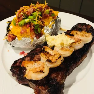 NY strip with grilled shrimp and a loaded baked potato! Come get yours!