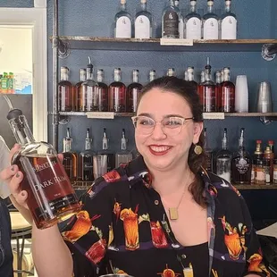 One of the owners showing us the bottle. So yummy!