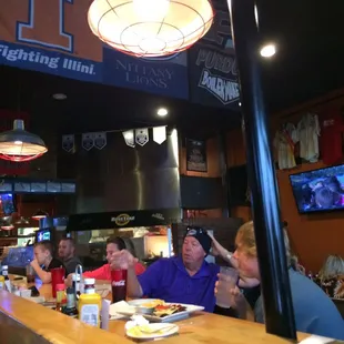 people sitting at the bar