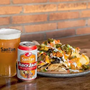 a plate of nachos and a glass of beer