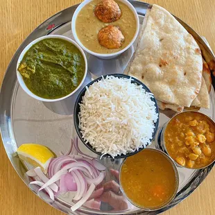 Thaali with Malai Kofta, Palak Paneer, Channa Masala, and Sambar