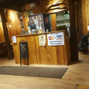 a bar with a menu on the wall