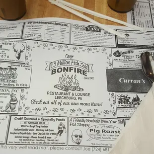 menus and utensils on a table