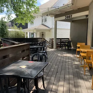 tables and chairs on a wooden deck