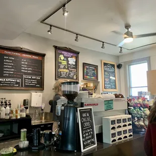 a coffee shop with menus on the wall