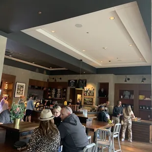 a group of people sitting at a bar