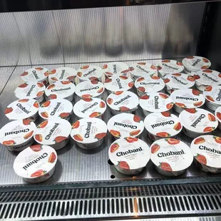 a display of yogurt cups