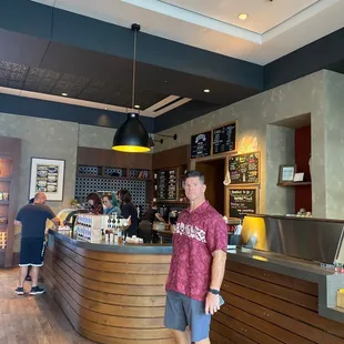 a man standing in front of a counter