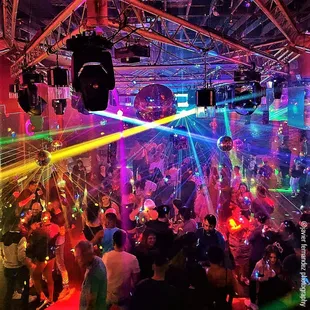 a crowded nightclub with disco lights