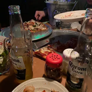 Crushed pizza and beers