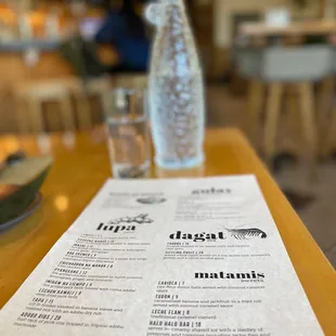a menu on a wooden table