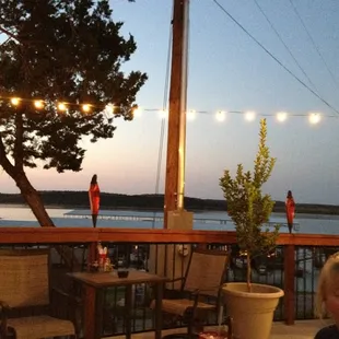 a woman sitting at a table with a plate of food