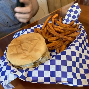a burger and fries in a basket