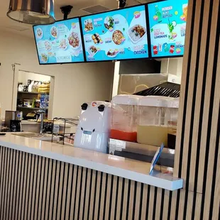 the counter and menus of the restaurant