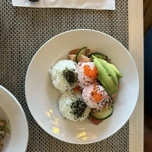 Mexicali poke bowl with spicy tuna. Furikake seasoned rice topped with crab and avo.