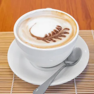 a cappuccino in a white cup