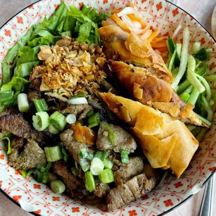 A very tasty bowl of bún thịt nướng. Hot, crispy egg rolls, tasty pork