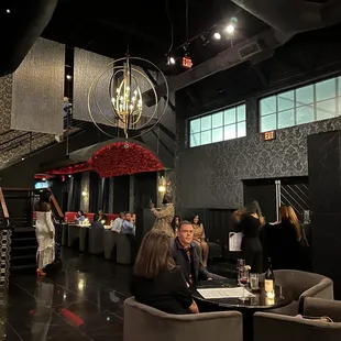Tables to dine &amp; stairs to the outdoor patio &amp; bar!