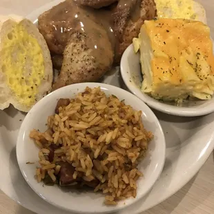 Baked chicken entree with jambalaya and baked macaroni
