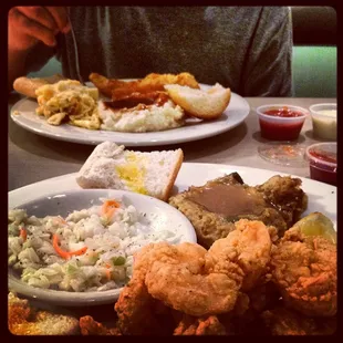 Fried catfish plate (back), fried shrimp plate with cole slaw and CORNBREAD DRESSING (heaven)