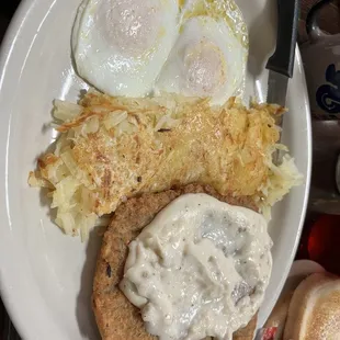 Chicken fried steak, hash browns and perfectly cooked over easy eggs