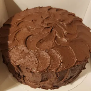 a chocolate cake with chocolate frosting