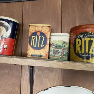 a variety of tins on a shelf