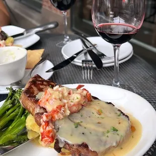 a plate of food and a glass of wine