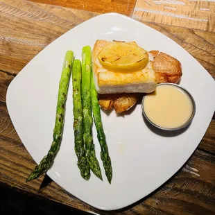 Alaskan Halibut with roasted asparagus and red potatoes with the beurre blanc on the side.