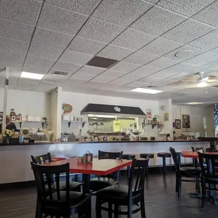 Interior photo of the dining area and kitchen and counter.