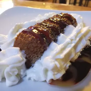 The Bono Oh-No, a deep fried Twinkie with whipped cream and chocolate sauce.