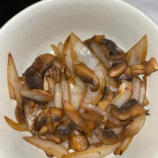 a bowl of mushrooms and onions