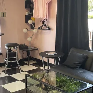 Cute seating area with merch - and coffee table terrarium!