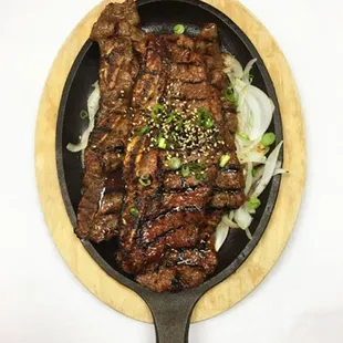 beef and onions in a skillet